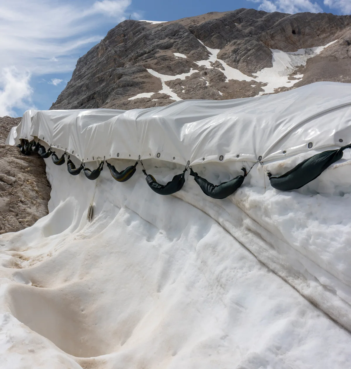 17-worst-ideas-21st-century-geoengineering A glacier covered in white plastic sheeting.