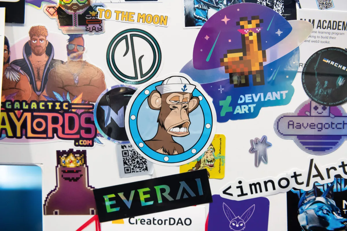 17-worst-ideas-21st-century-nft-art A selection of NFT art project stickers.