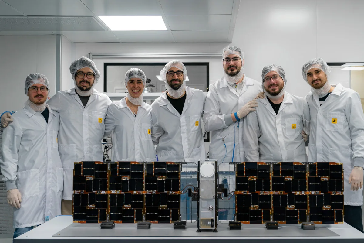 tyvak_s_milani_cubesat_team_cmyk A group of scientists standing behind the Milani CubeSat.